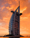 Our arrival at Burj Al Arab was of true Seven Star style. Four lovely hostesses and a host welcomed us in the tradition of Jumeirah - with warm smiles, cold towels, Arabian coffee, sweet dates and chilled rosewater. Much has been written about the decorative style of Burj Al Arab...